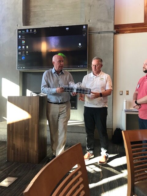 Two men exchanging gifts