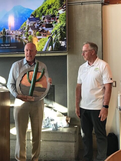 Two men exchanging gifts